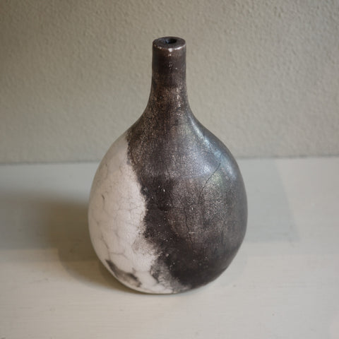 Unique ceramic bottle vase in Naked Raku firing technique, featuring organic smoke patterns.