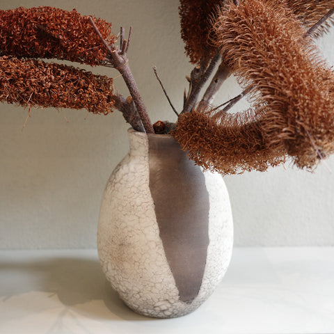 Handmade naked raku ceramic vase with smoky crackle surface by Jacqui Sosnowski