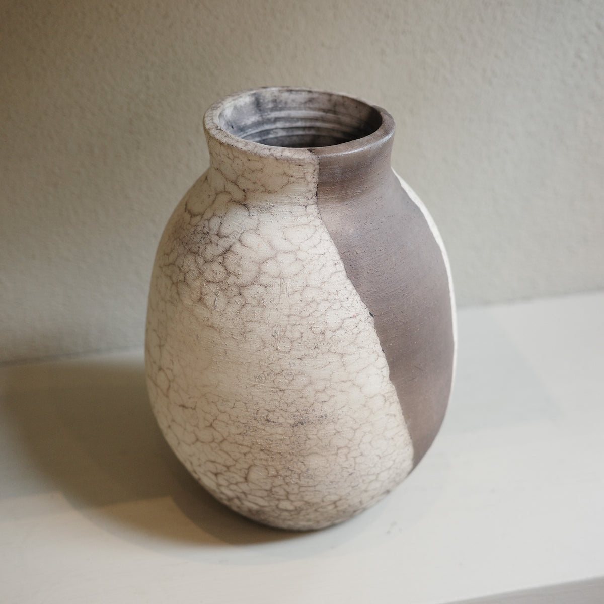 Handmade naked raku ceramic vase with smoky crackle surface by Jacqui Sosnowski