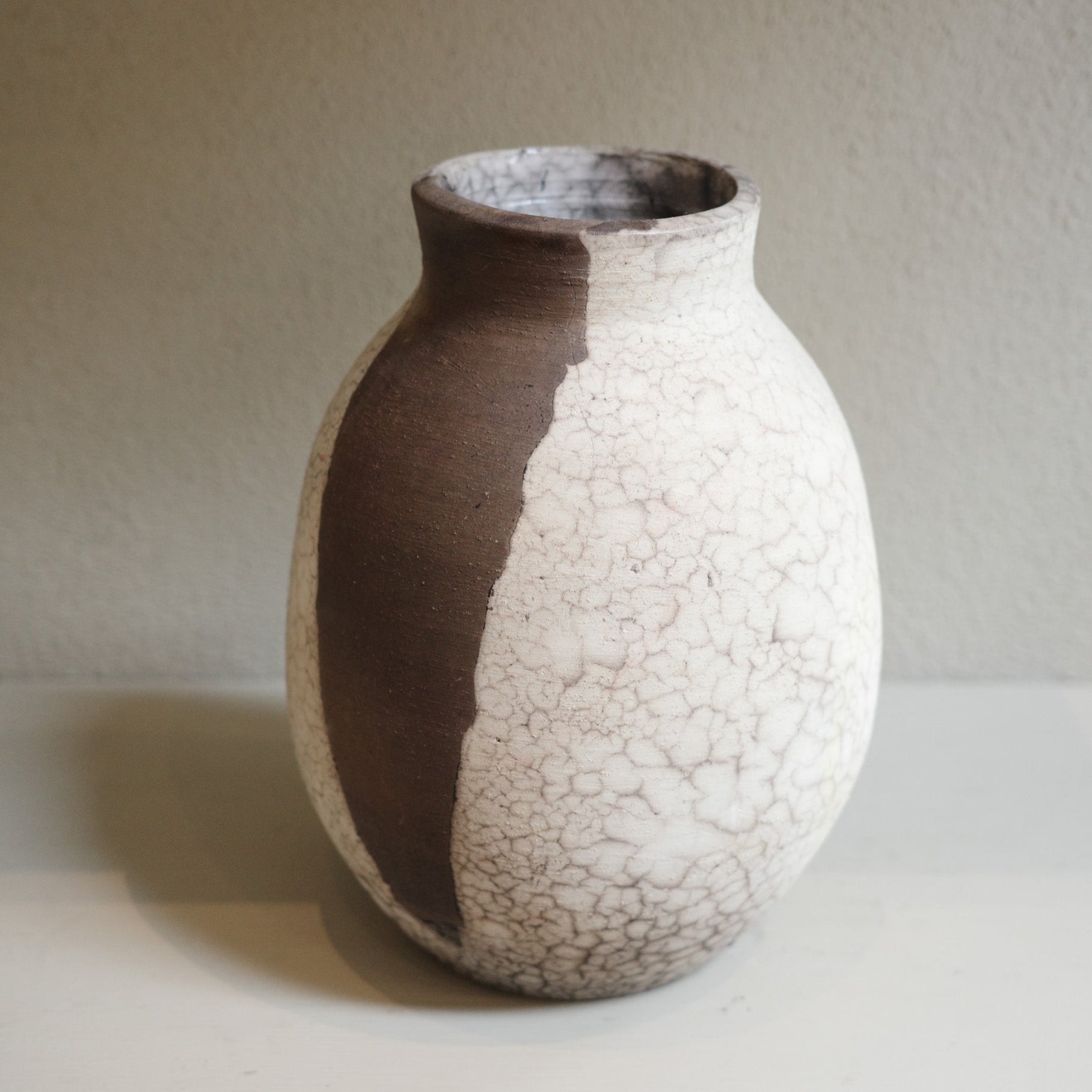 Contemporary ceramic vase crafted with naked raku firing technique