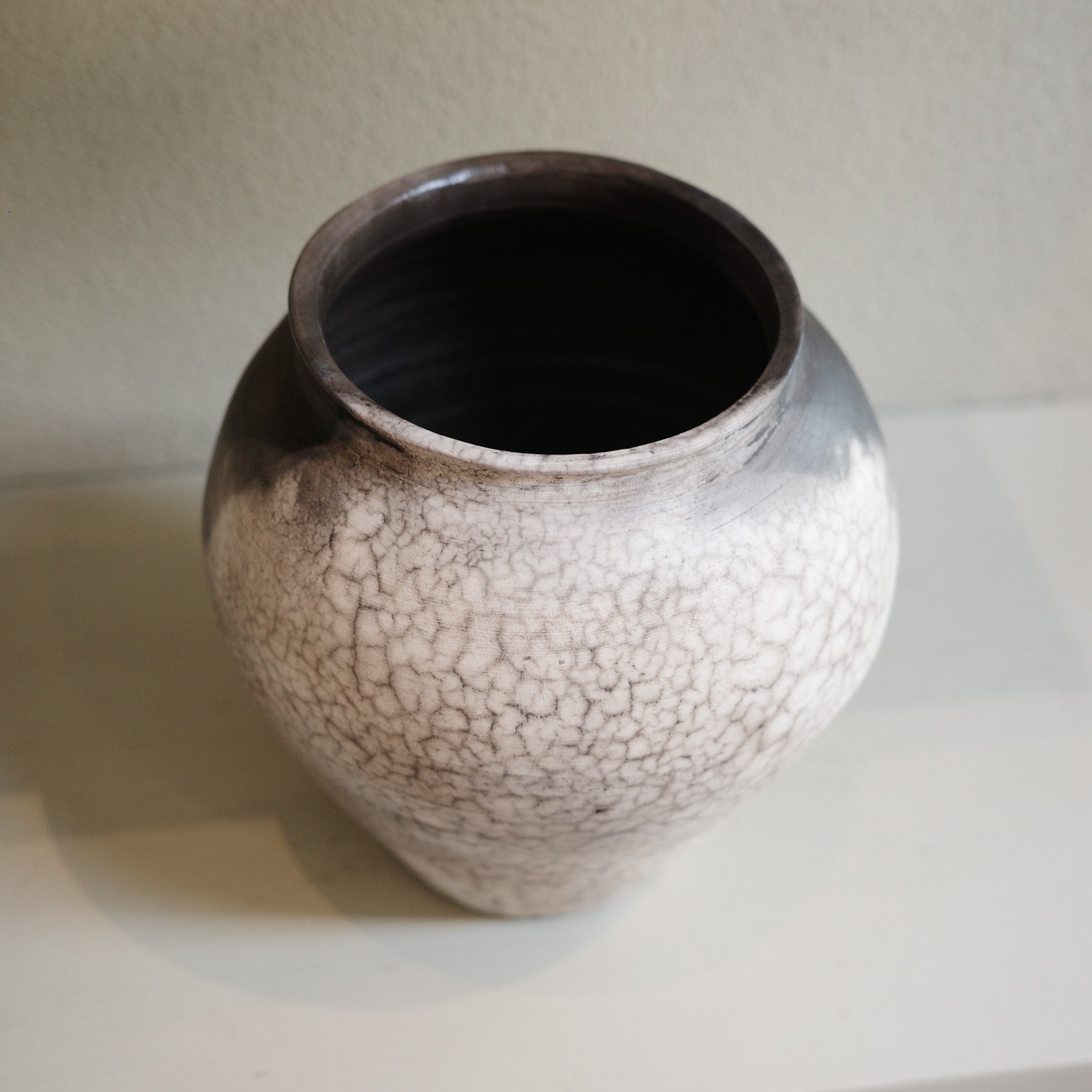 Large Naked Raku Vase – handmade ceramic with smoky black and white surface by Jacqui Sosnowski, top view.