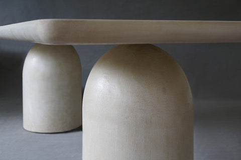 Close-up view of Nexus Dining Table in Oyster finish, highlighting its minimalist design.