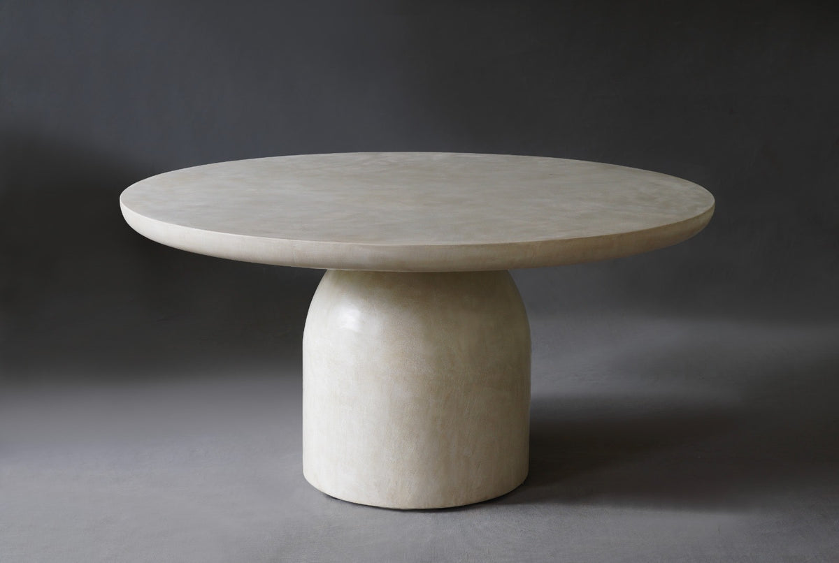 Front view of Nexus Round Dining Table in Oyster showing round profile and edge.