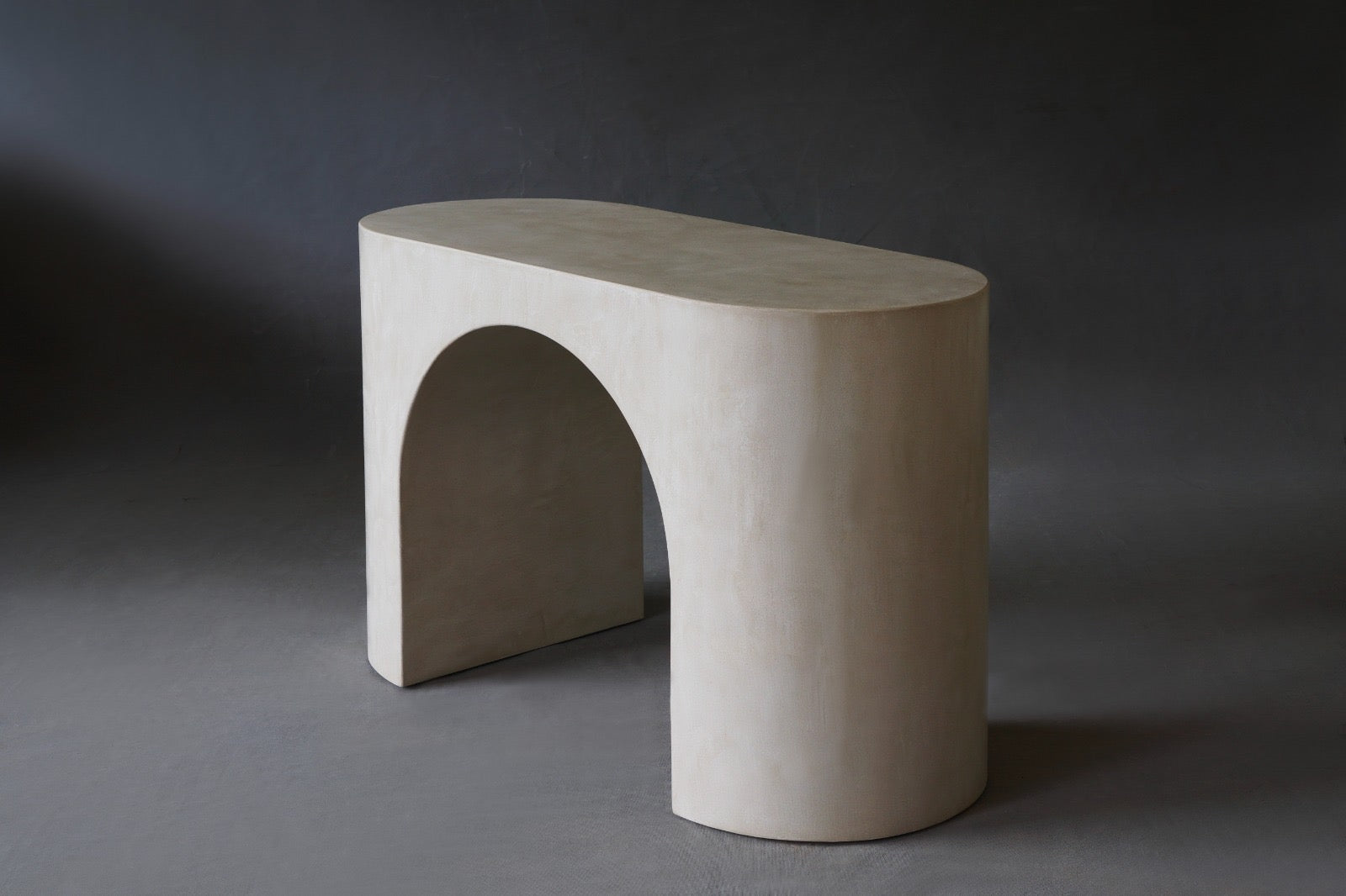 Side view of the Nova Console Table in Pebble micro cement finish, 1200 mm length.