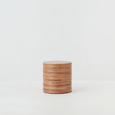 Close-up of tightly woven rattan texture on the Palma side table showing craftsmanship