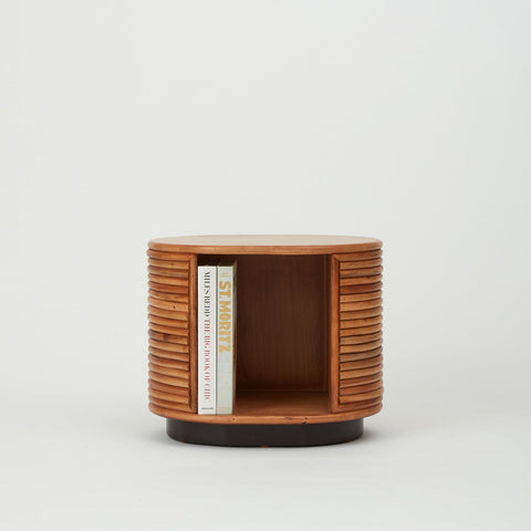 Panama natural rattan side table styled with books 