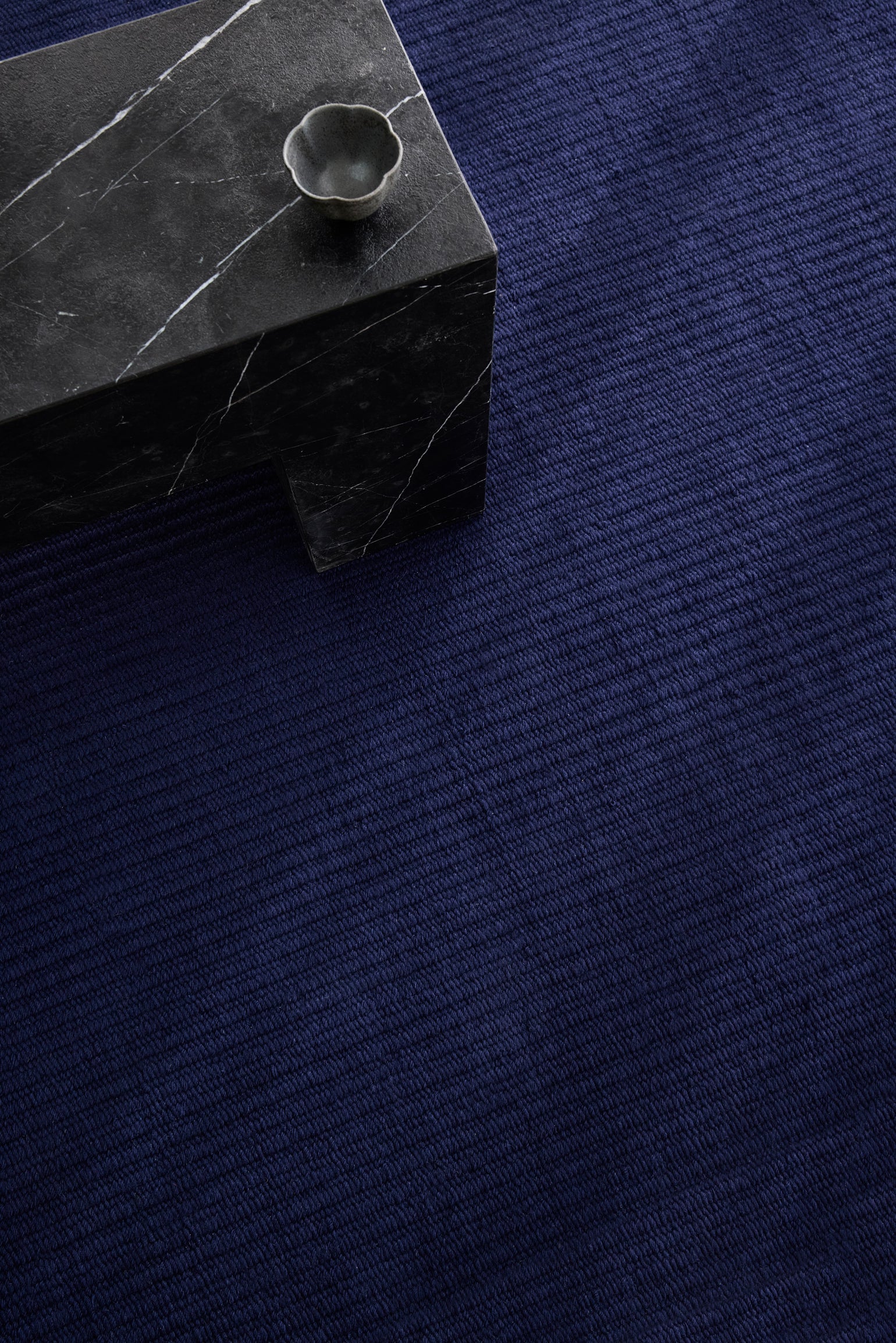 Pebble Flatweave Rug in Navy – handwoven New Zealand wool flatweave with subtle pebble-like texture.