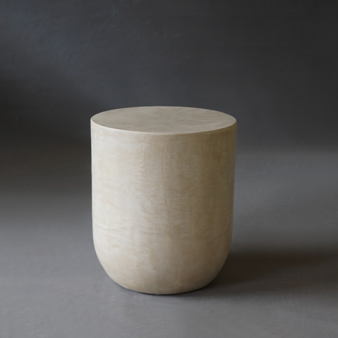 Remi Side Table in Pebble micro cement finish, highlighting its round shape and smooth texture.