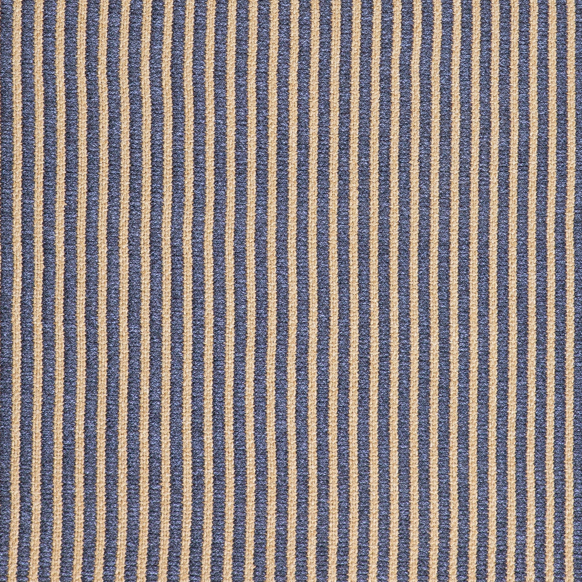Close-up of textured ribbed navy and beige weave on outdoor rug