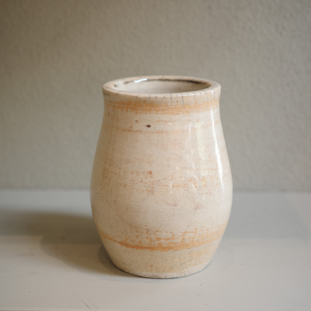 Handmade small Raku vase with subtle orange markings and crackle glaze – artisanal ceramic by Jacqui Sosnowski.