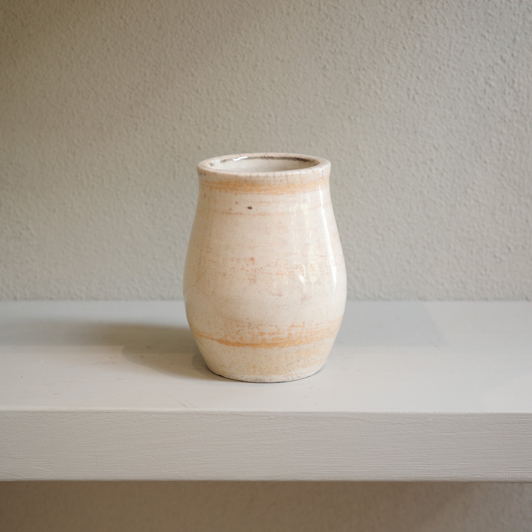 Handmade small Raku vase with subtle orange markings and crackle glaze – artisanal ceramic by Jacqui Sosnowski.